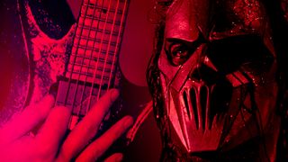 Closeup of Mick Thomson with an ESP guitar