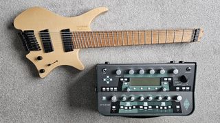 This writer's Strandberg guitar and Kemper Profiler on a beige carpet