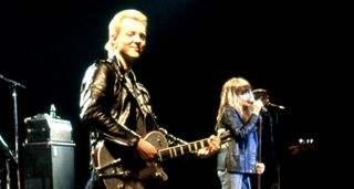 Billy Zoom (left) and Exene Cervenka of X perform onstage &ndash; Zoom has his customary Gretsch guitar, his hair dyed blond