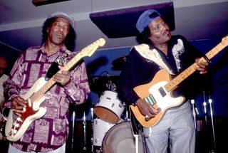 Buddy Guy (left) and Albert Collins perform onstage at the Legends nightclub in Chicago, Illinois in 1985