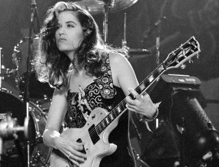 Vicki Peterson performs onstage