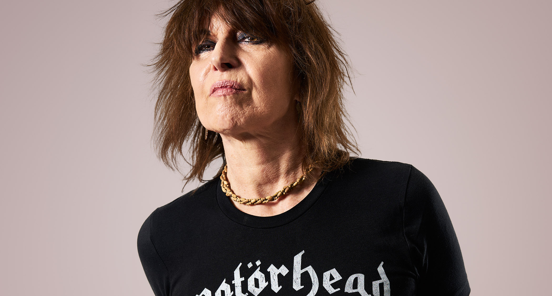 Chrissie Hynde of the Pretenders photographed in a Mot&ouml;rhead T-shirt. Her Ice Blue signature Telecaster is her weapon of choice.
