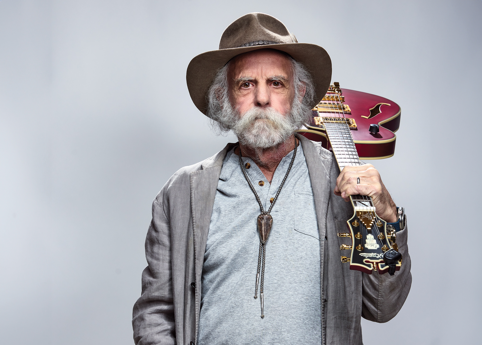 Bob Weir poses with his D'Angelico signature guitar