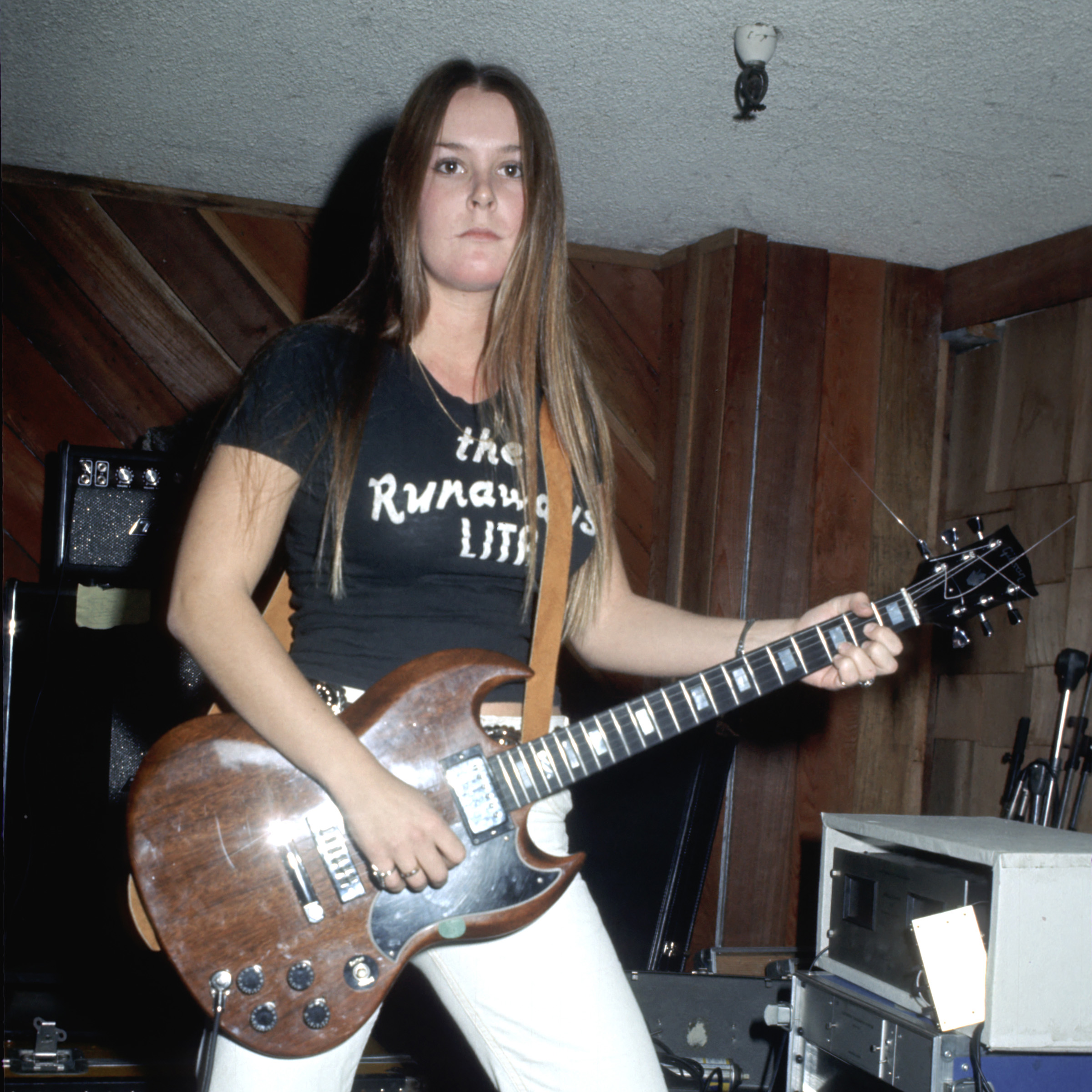 Guitarist Lita Ford of the rock band "The Runaways" performs on stage in 1976