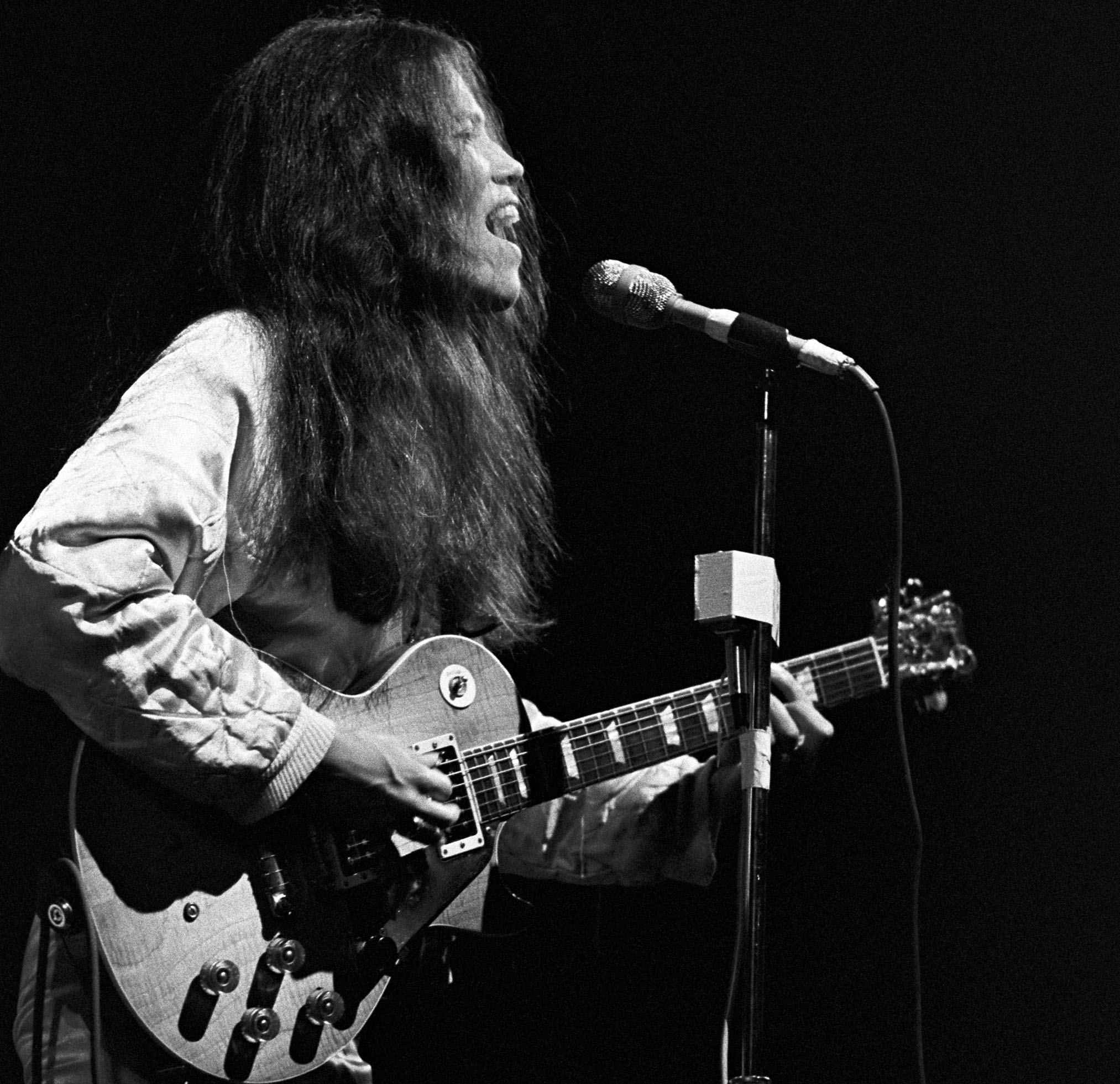 June Millington performs onstage with Fanny at Alex Cooley's Electric Ballroom in Atlanta, Georgia on June 5, 1975