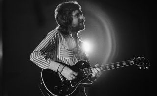 Mick Rogers performs onstage
