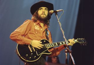 Mick Rogers performs onstage