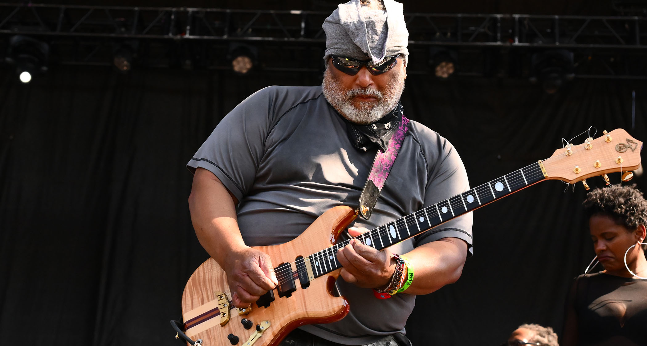 Michael &ldquo;Kidd Funkadelic&rdquo; plays his Alembic electric guitar onstage during Chicago's Riot Fest, 2003. He wears shades and a grey t-shirt